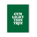Green greeting card with bold white text reading Cum Light This Tree in playful font