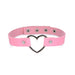 Pink vegan leather choker with a silver heart-shaped metal centerpiece and adjustable snap closures.