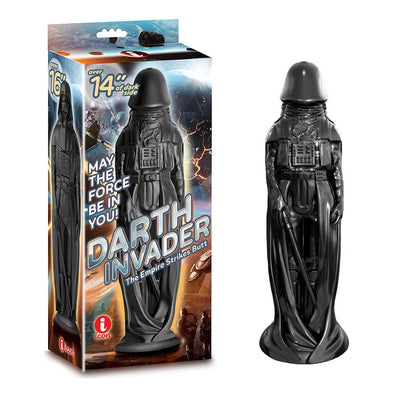 Black novelty adult toy shaped like a sci-fi warrior with a strong suction base, displayed next to its themed packaging.