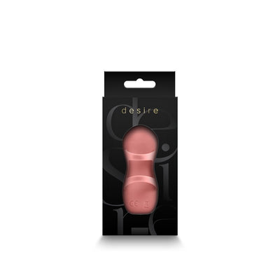 Desire Fingerella finger massager in rose pink displayed in sleek black packaging with transparent window.