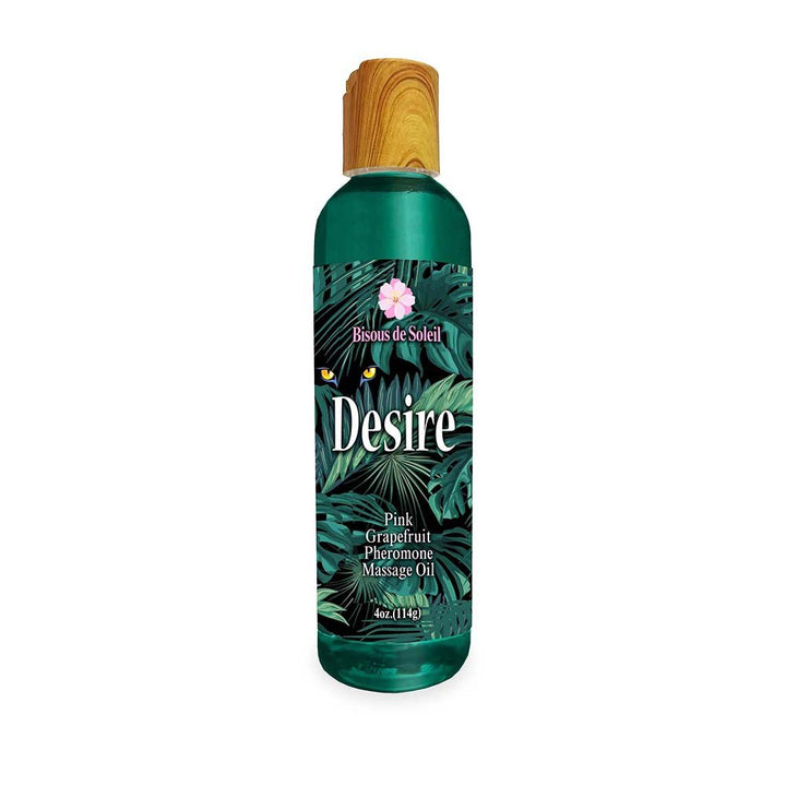 4 oz Desire Pheromone Massage Oil bottle with tropical leaf design and wooden cap, pink grapefruit scent by Bisous de Soleil.