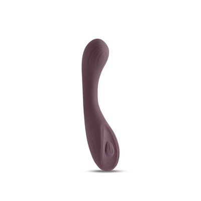 Plush silicone Desire Pure multi-speed vibrator in deep plum with curved design and power button.