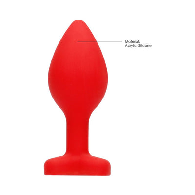 Large red silicone butt plug with flared base and diamond-shaped accent, designed for comfort and safety.