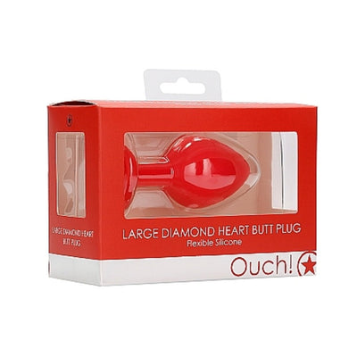 Large red diamond heart-shaped butt plug in clear display box with red and white packaging.