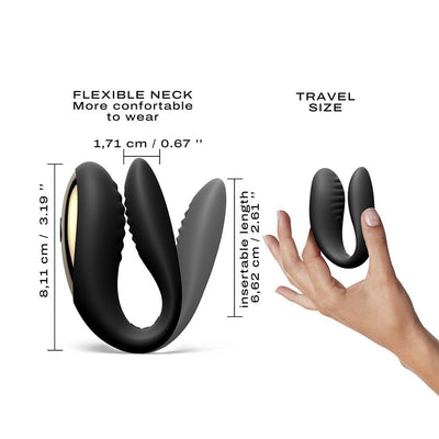 Black flexible wearable device with gold accents shown with dimensions and held in hand for travel size reference.