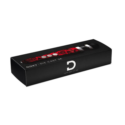Black rectangular box packaging of Doxy Die Cast 3R rose pattern rechargeable wand massager with red rose design on the product.