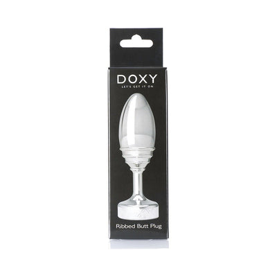 Doxy Ribbed Plug in sleek silver aluminum with tapered shape and ribbed texture, displayed in black packaging.