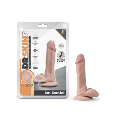 Dr. Daniel realistic silicone dildo with suction cup base next to its retail packaging showing product features.