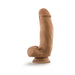 Realistic silicone dildo with suction cup base in natural skin tone, 7 inches long with detailed texture and shape.