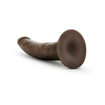 Realistic 7.5-inch self-lubricating dildo in dark brown with suction cup base for hands-free use.