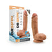Chocolate-colored 8.5-inch realistic dildo with balls and suction cup base next to its packaging box.