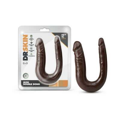 Dr. Skin Mini Double Dong in dark brown with realistic texture, shown inside and outside clear packaging.