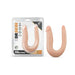 Dr. Skin Mini Double Dong in flesh tone with two different-sized ends, shown in packaging and outside on white background.