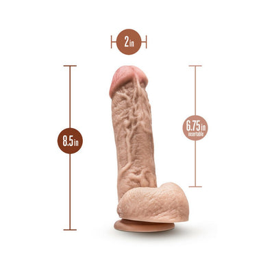 Realistic 8.5 inch dildo with 6.75 inch insertable length and 2 inch girth, featuring a suction cup base in flesh tone.
