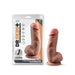 Dr. Skin Plus 7-inch realistic poseable dildo with suction cup base and balls in natural skin tone next to its packaging.
