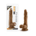 Realistic brown dildo with suction cup base shown in and out of packaging labeled Dr. Skin Stud Muffin 8.5 inch length