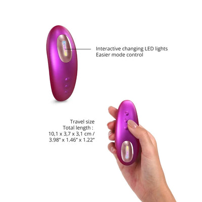 Compact iridescent berry Love To Love Dreamer vibrator with interactive LED lights and travel-friendly size held in hand.