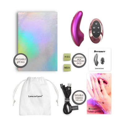 Love To Love Dreamer iridescent berry device with remote, reusable gift box, USB cable, glow-in-the-dark dice, storage pouch, and user guide.