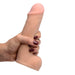 Hand holding a beige dual density realistic dildo with a smooth, firm shaft and lifelike details against a white background.