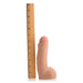 Beige dual density realistic dildo standing next to a wooden ruler showing 6.5 inches length.