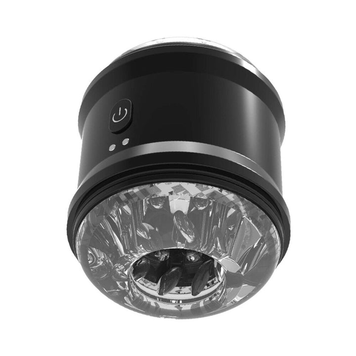 Black cylindrical vibrating masturbator cup with textured clear inner tunnel and power button on the side.