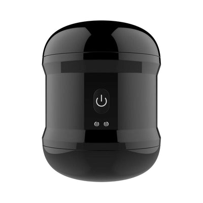 Sleek black Dynamo vibrating masturbator cup with power button and compact, discreet design.