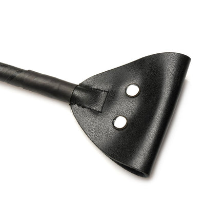 Close-up of black vegan leather tip with two metal buttons on the handle of an e-stim crop.