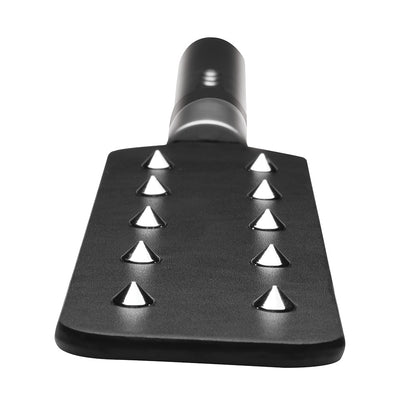 Black vegan leather paddle with two rows of metal spikes and a smooth handle for e-stim sensation play.