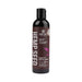Bottle of Earthly Body Hemp Seed Massage and Body Oil, 8 oz, with dark label and purple leaf design.