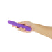 Hand holding a sleek purple silicone vibrator with a smooth, rounded tip and simple design.