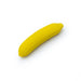 Compact yellow silicone vibrator shaped like a banana with smooth, curved design and USB charging port.