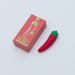 Emojibator Chili Pepper USB vibrator with red and green silicone design next to its red and green packaging box.