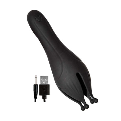 Black silicone enhancer with textured flickering tips and USB charging cable on white background.
