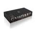 Black rectangular box packaging for Enigma with rose gold lettering and subtle textured side detail.