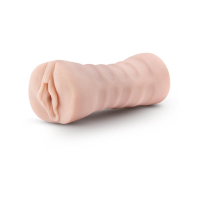 Beige EnLust Destini vibrating male stroker with textured exterior and open-ended design on white background.