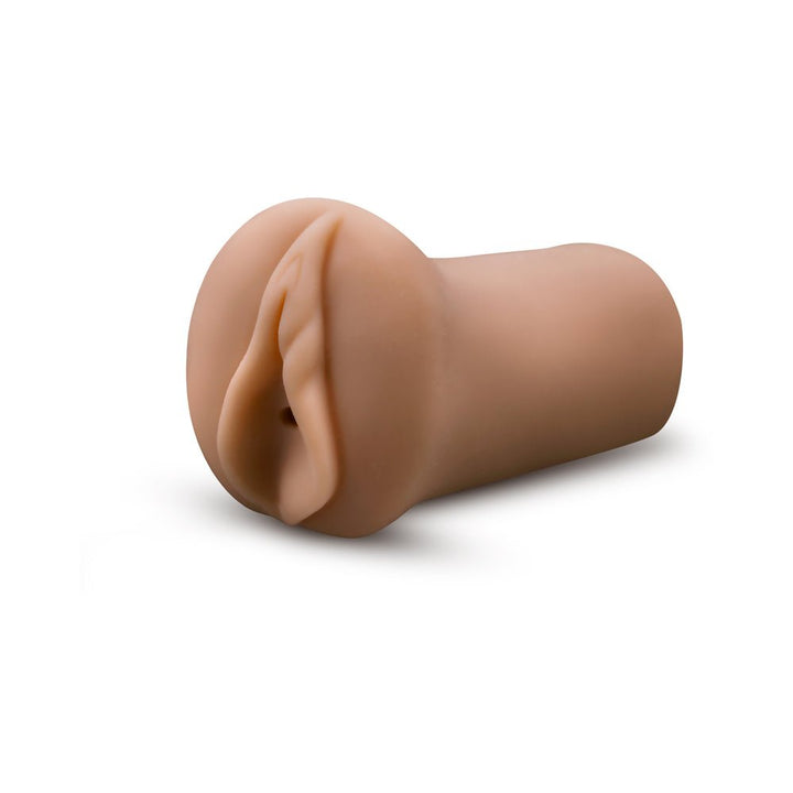 Tan-colored realistic male stroker with soft, ribbed interior and open-ended design for enhanced pleasure.