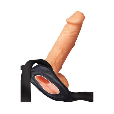 Realistic hollow strap-on with adjustable black harness and flesh-toned insertable sleeve for versatile wear.