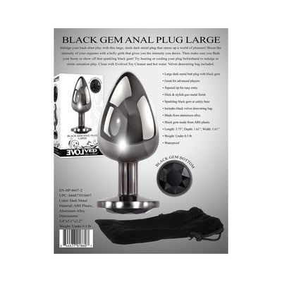 Large dark metal anal plug with tapered tip and black gem base, shown with black velvet drawstring storage bag.