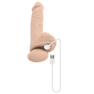 Light skin tone realistic silicone dildo with suction base and USB magnetic rechargeable cable attached.