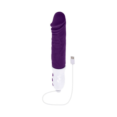 Rechargeable plum-colored silicone thrusting vibe with textured white handle and USB charging cable.