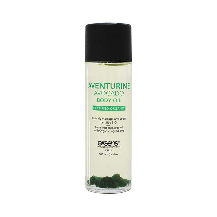 Bottle of EXSENS Aventurine Avocado certified organic body oil with green stones inside and black cap