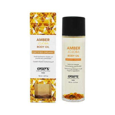 EXSENS Amber Jojoba organic body oil bottle with amber crystals and matching box with golden geometric design
