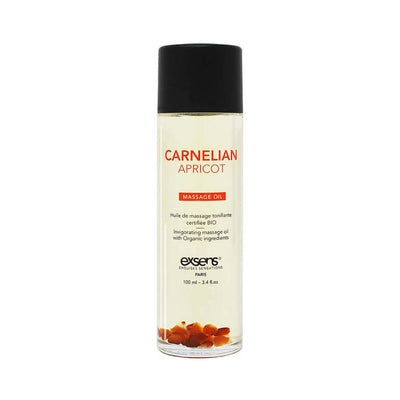 Bottle of EXSENS Carnelian Apricot organic massage oil with visible carnelian stones inside and black cap