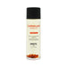 Bottle of EXSENS Carnelian Apricot organic massage oil with visible carnelian stones inside and black cap