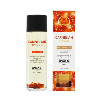 EXSENS Carnelian Apricot organic massage oil bottle with embedded carnelian stones and matching orange-accented box packaging.