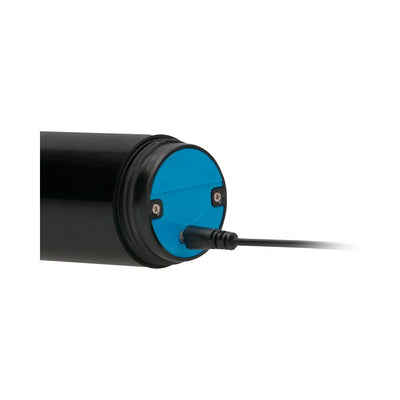 Close-up of a clear rechargeable auto pump with a blue charging port and connected power cable.