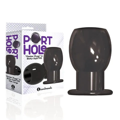 Black hollow tunnel butt plug with flared base displayed next to its white and purple Port Hole branded packaging.