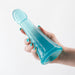 Hand holding a translucent blue textured flexible probe with a rounded tip and flared base.