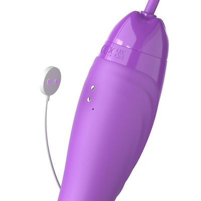 Close-up of purple Her Ultimate Pleasure Max device with magnetic USB charging connector on white background.