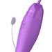 Close-up of purple Her Ultimate Pleasure Max device with magnetic USB charging connector on white background.
